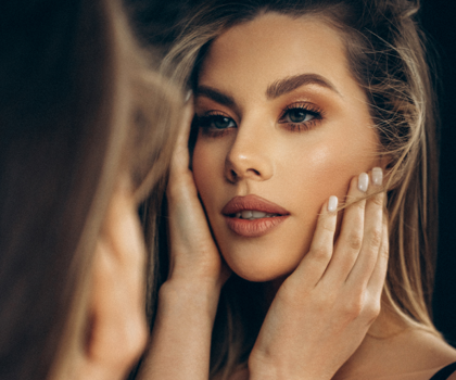 Portrait of a female model looking in the mirror